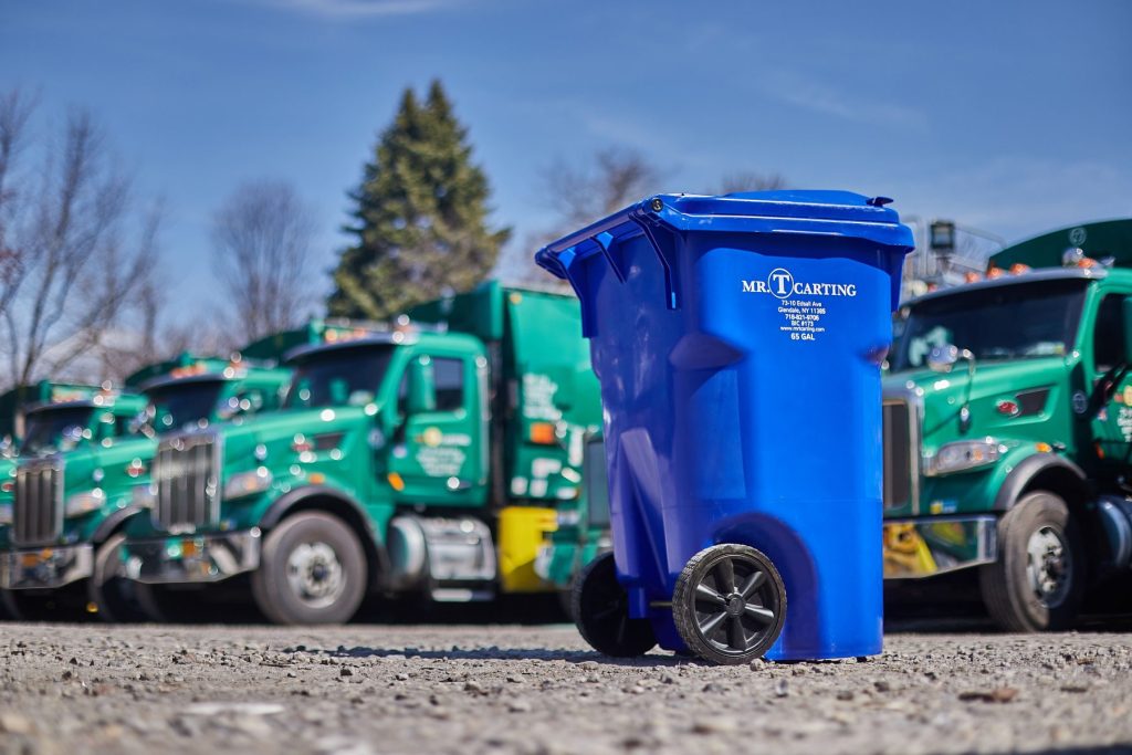 A photograph of a blue Mr. T Carting container.